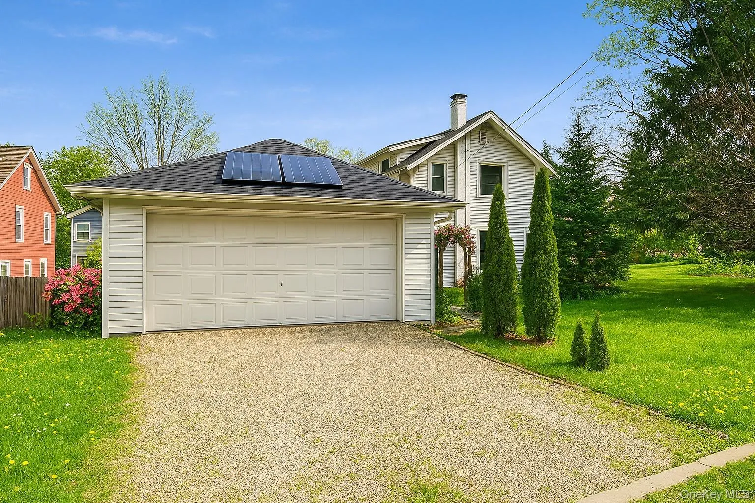 View of detached garage in the summer View of detached garage in the summer