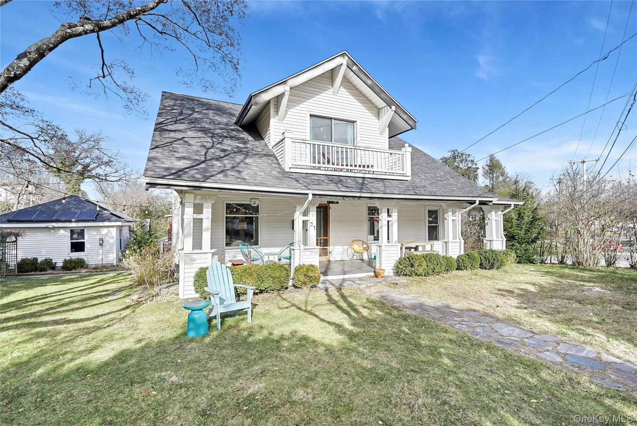 View of front of the home featuring a beautiful covered porch, and the second floor balcony View of front of the home featuring a beautiful covered porch, and the second floor balcony