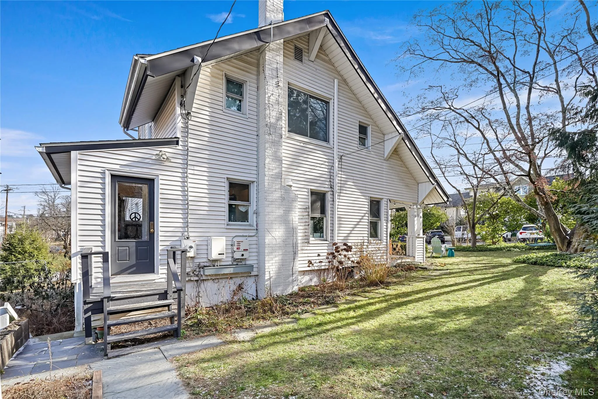 Side of property with view of mudroom entrance Side of property with view of mudroom entrance