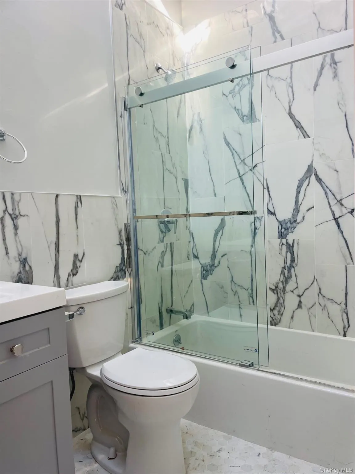 Full bath with enclosed tub / shower combo and vanity Full bath with enclosed tub / shower combo and vanity