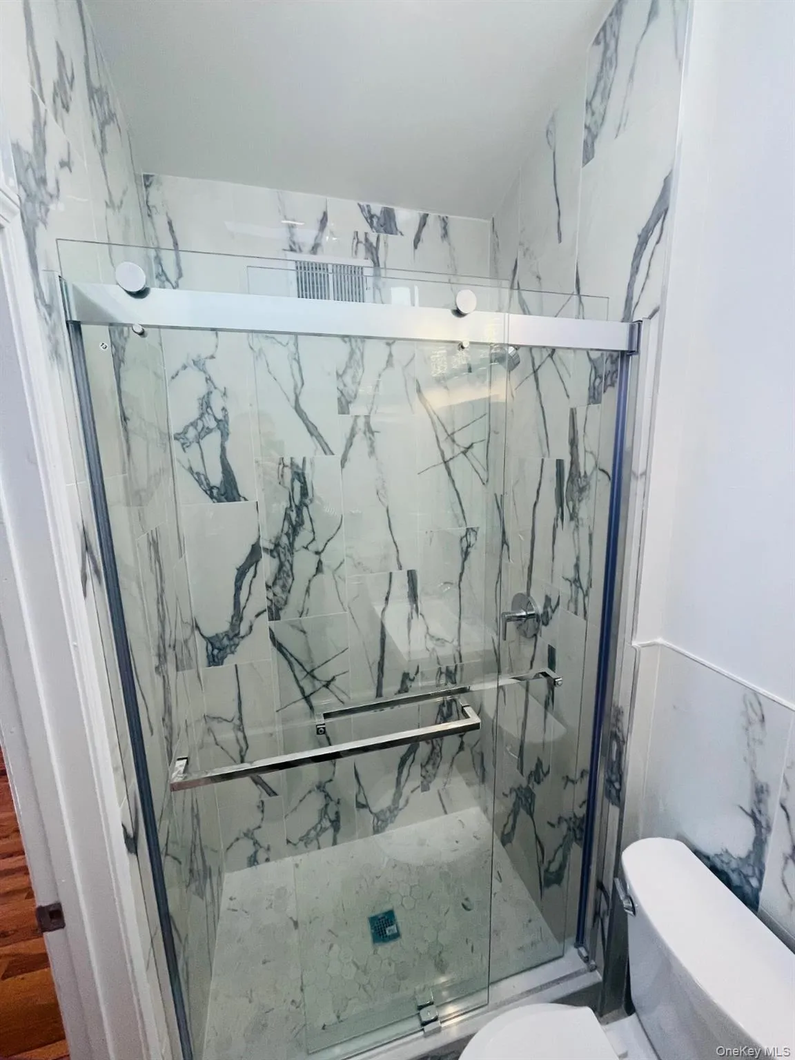 Bathroom with a marble finish shower Bathroom with a marble finish shower