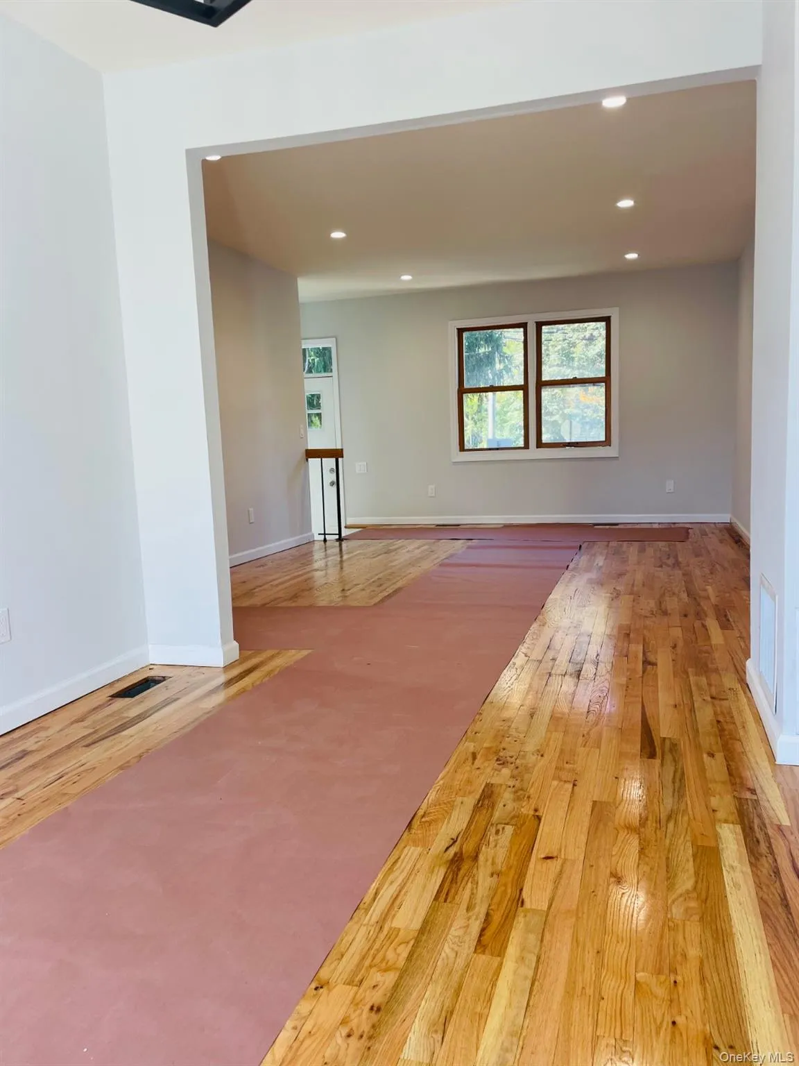 Unfurnished room featuring light wood-style flooring and recessed lighting Unfurnished room featuring light wood-style flooring and recessed lighting