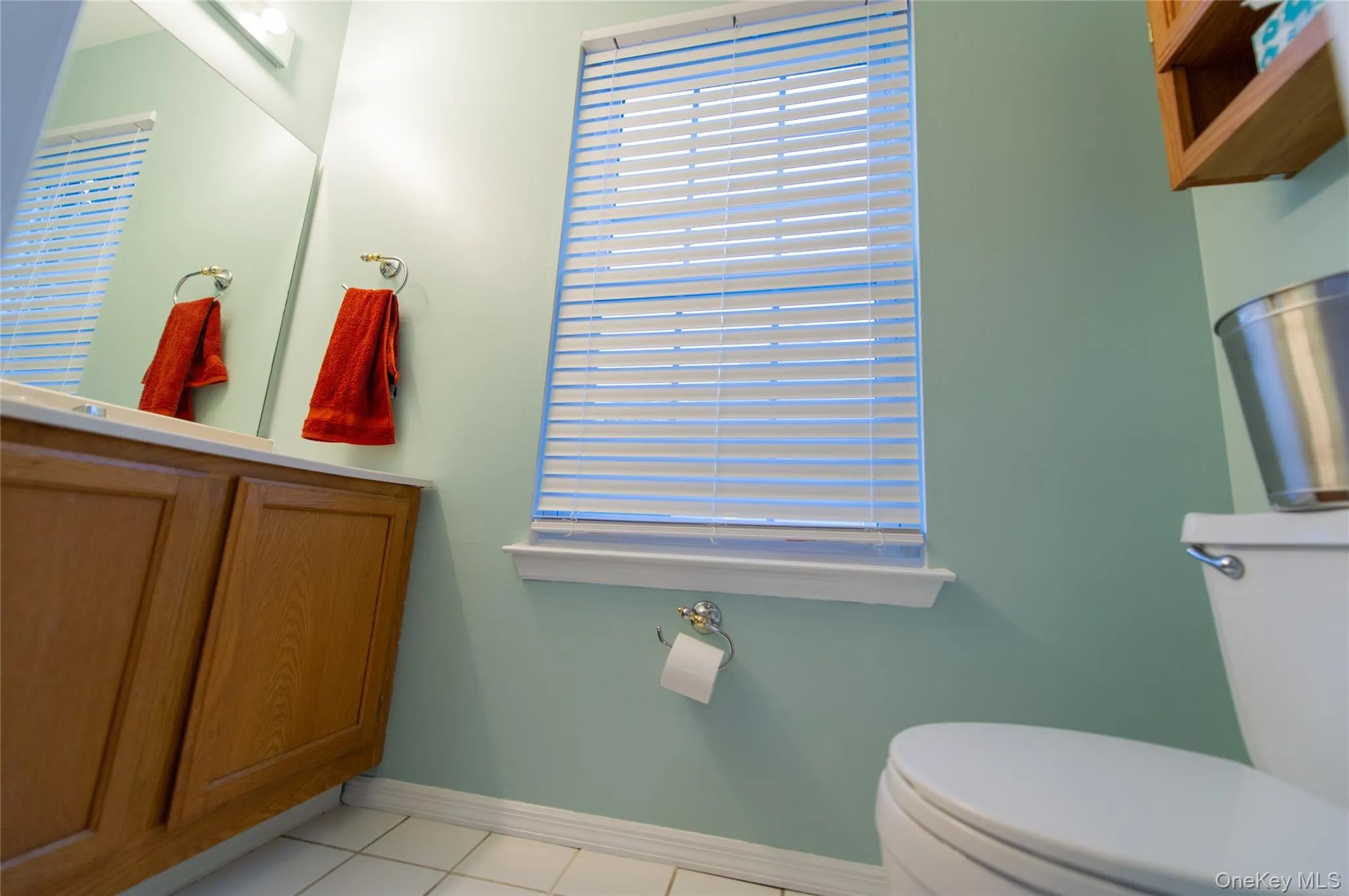 Bathroom with light tile patterned floors and toilet Bathroom with light tile patterned floors and toilet
