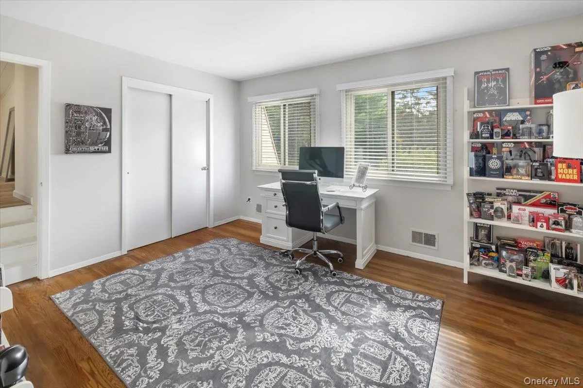 Home office with dark wood finished floors Home office with dark wood finished floors