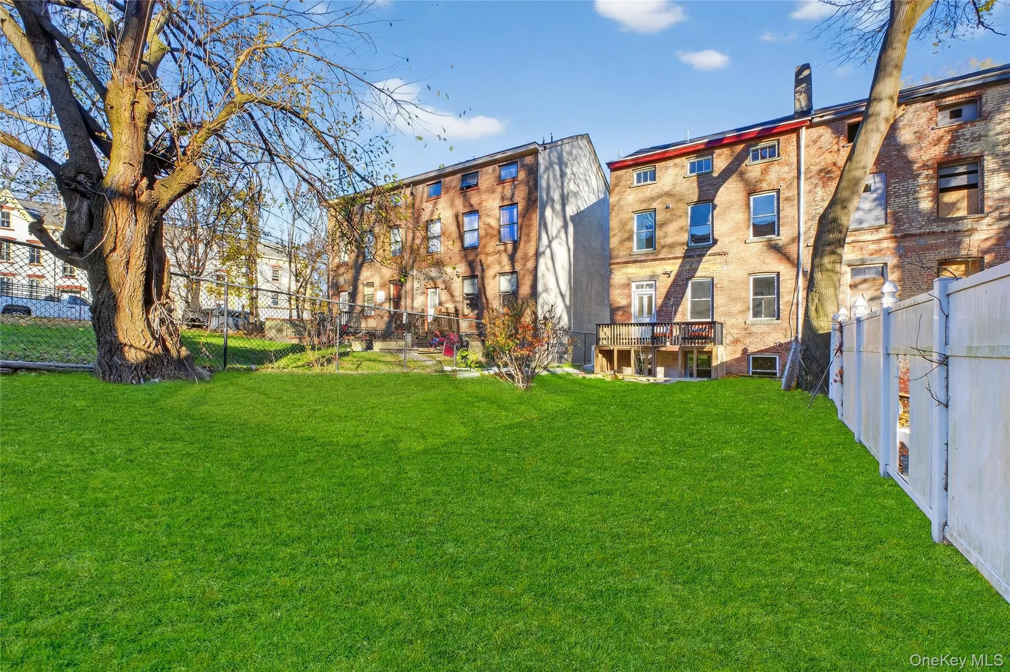 View of yard with a wooden deck View of yard with a wooden deck