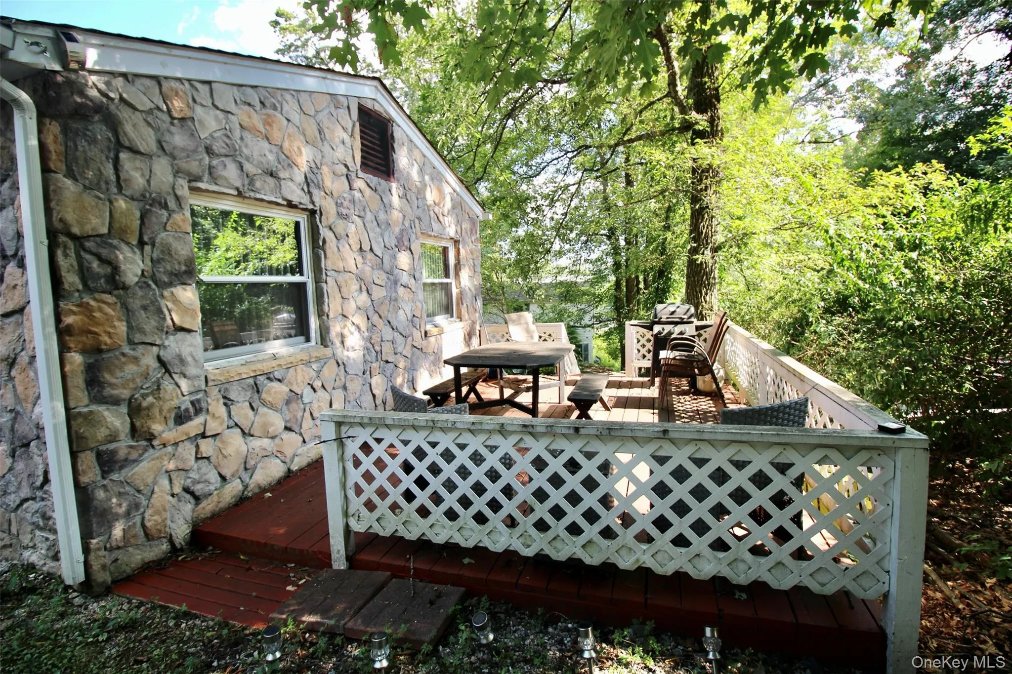 Wooden deck with outdoor dining space Wooden deck with outdoor dining space