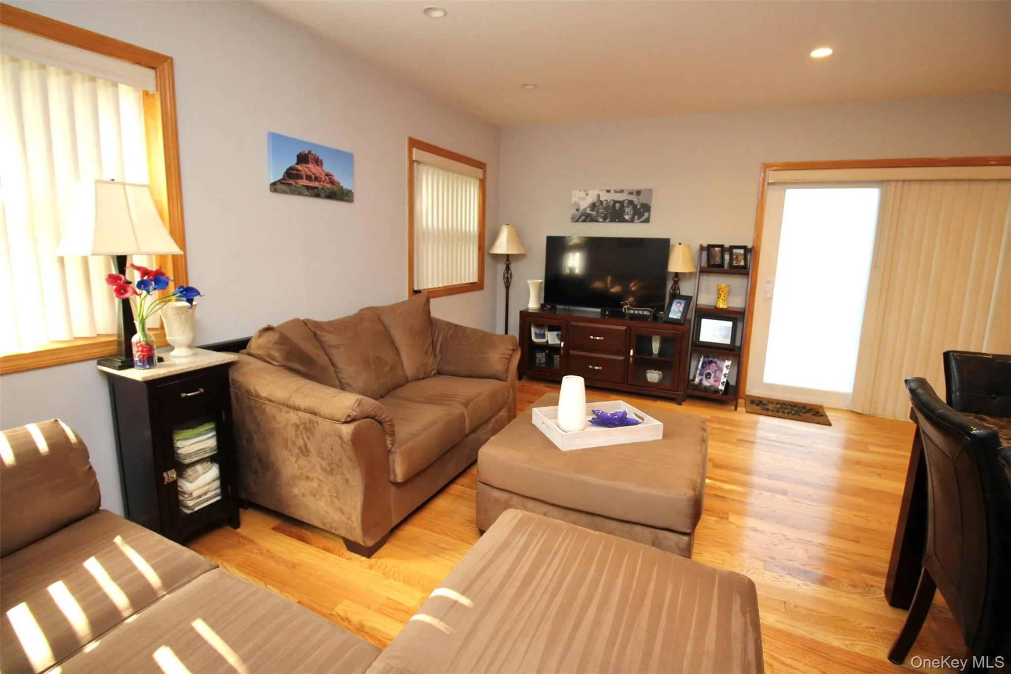 Living room with light wood-type flooring and recessed lighting Living room with light wood-type flooring and recessed lighting