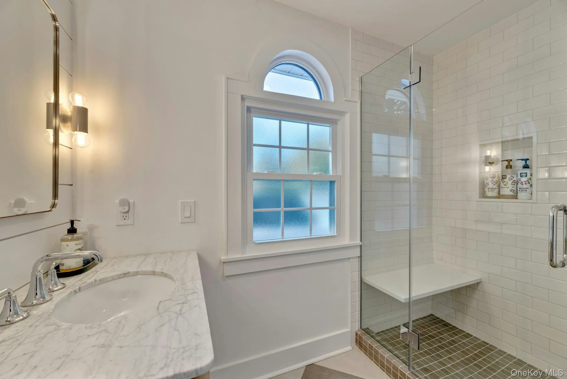 Bathroom with a shower stall and vanity Bathroom with a shower stall and vanity