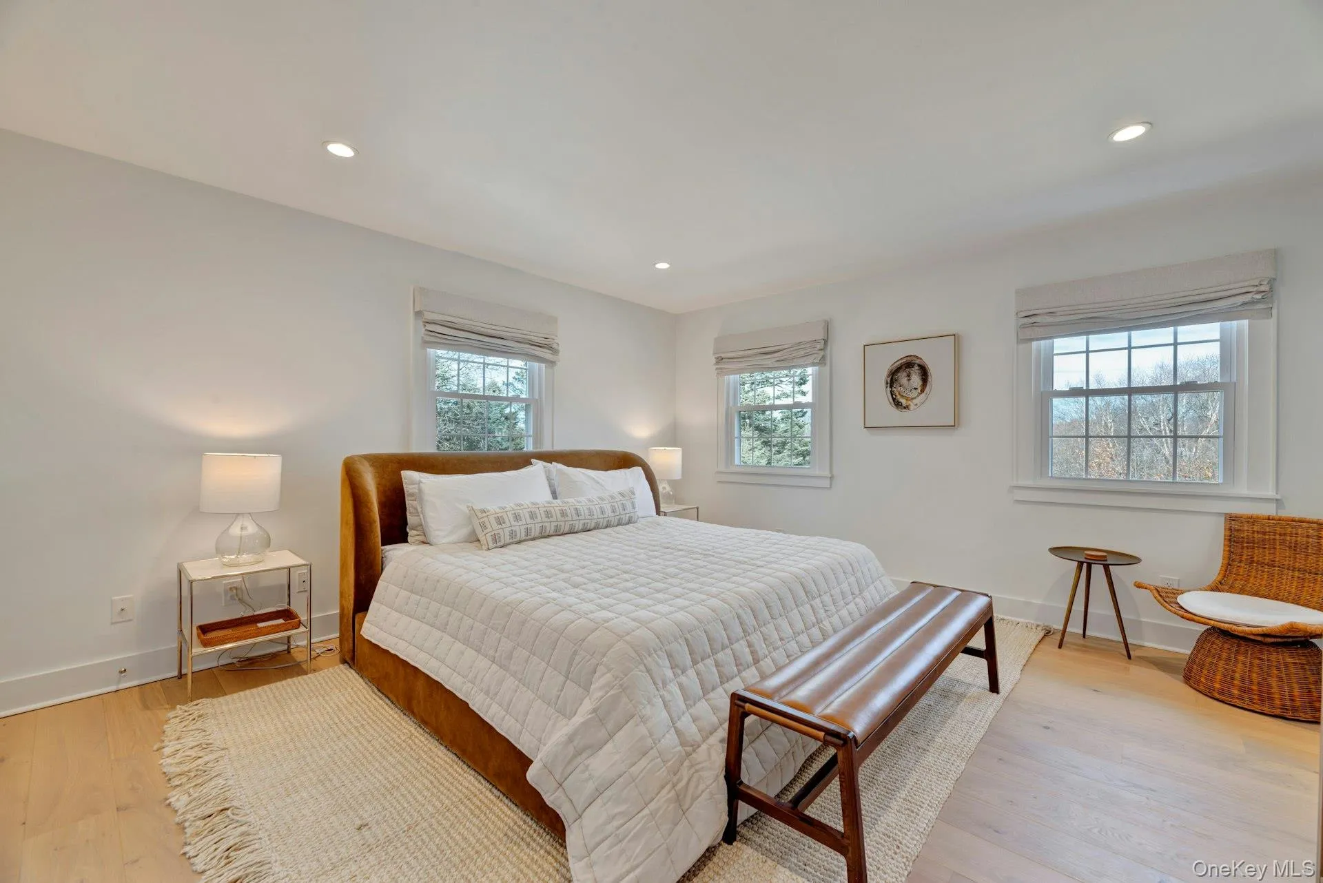 Bedroom with light wood-type flooring and recessed lighting Bedroom with light wood-type flooring and recessed lighting