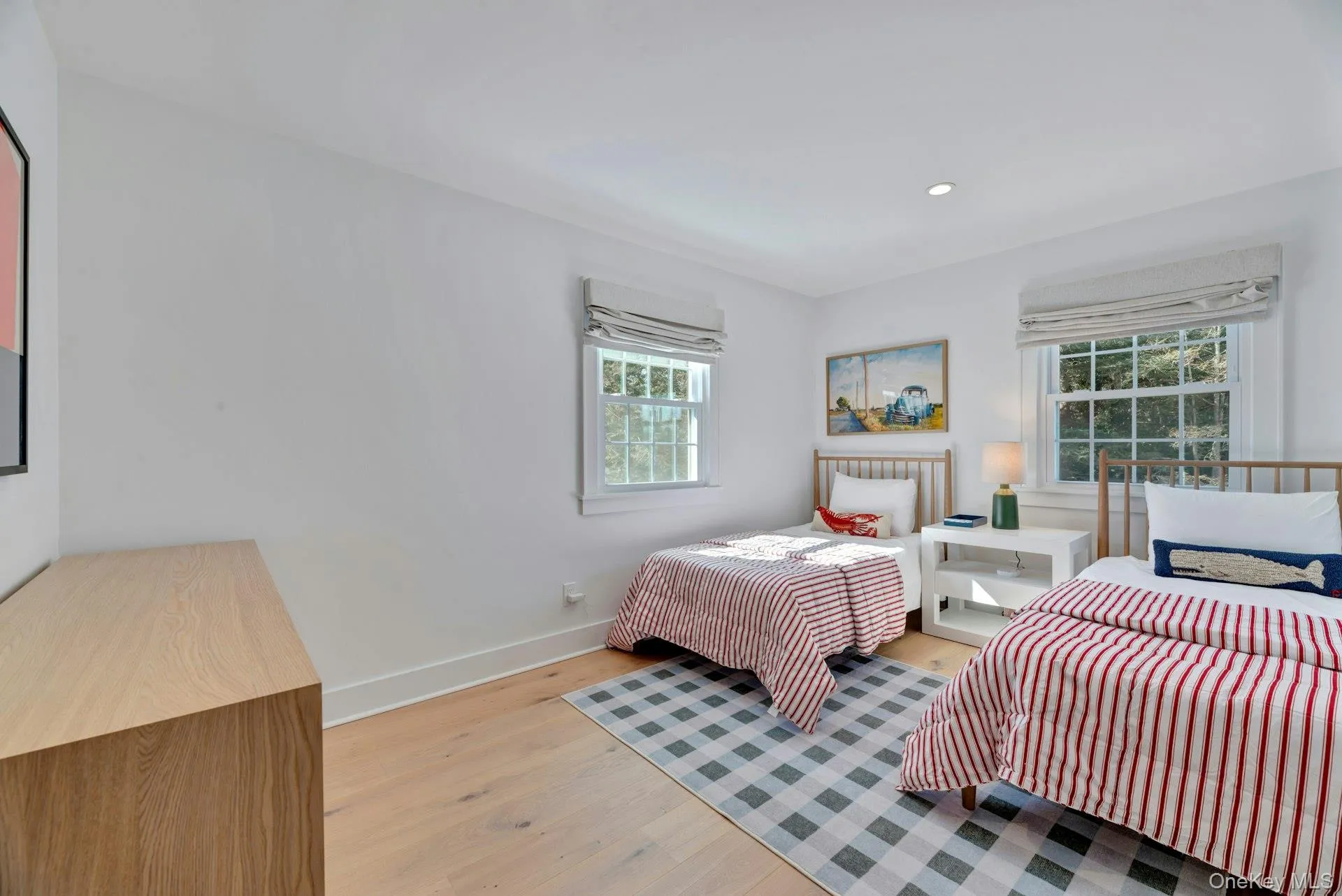 Bedroom featuring light wood-style flooring and recessed lighting Bedroom featuring light wood-style flooring and recessed lighting