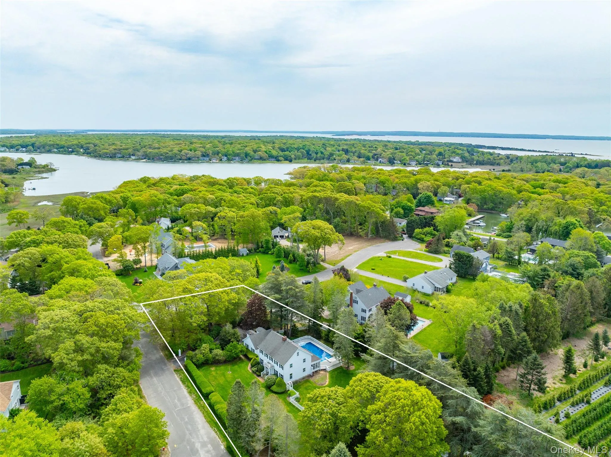 View of property location featuring a nearby body of water and property parcel outlined View of property location featuring a nearby body of water and property parcel outlined