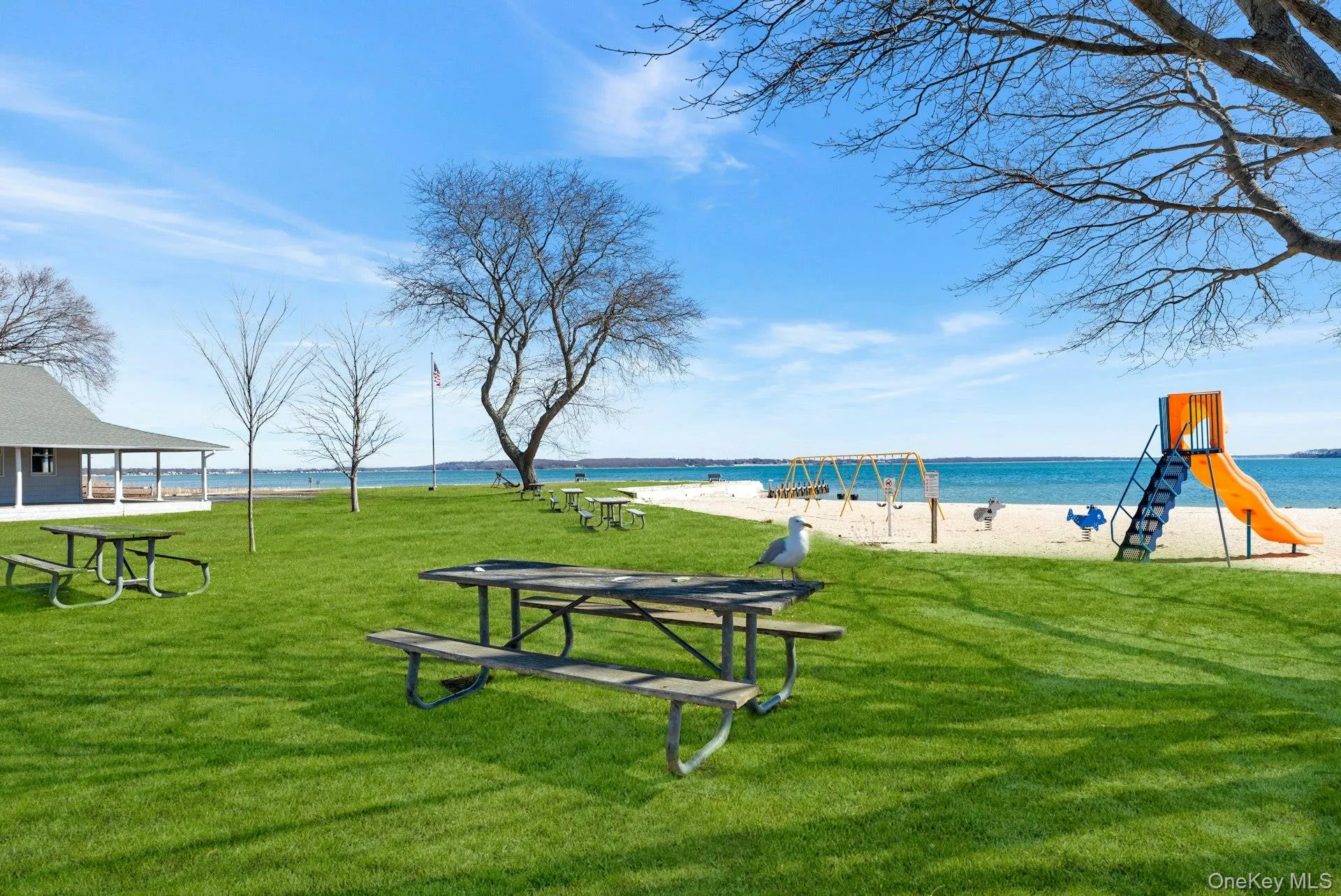 View of property's community featuring a yard and a water view View of property's community featuring a yard and a water view