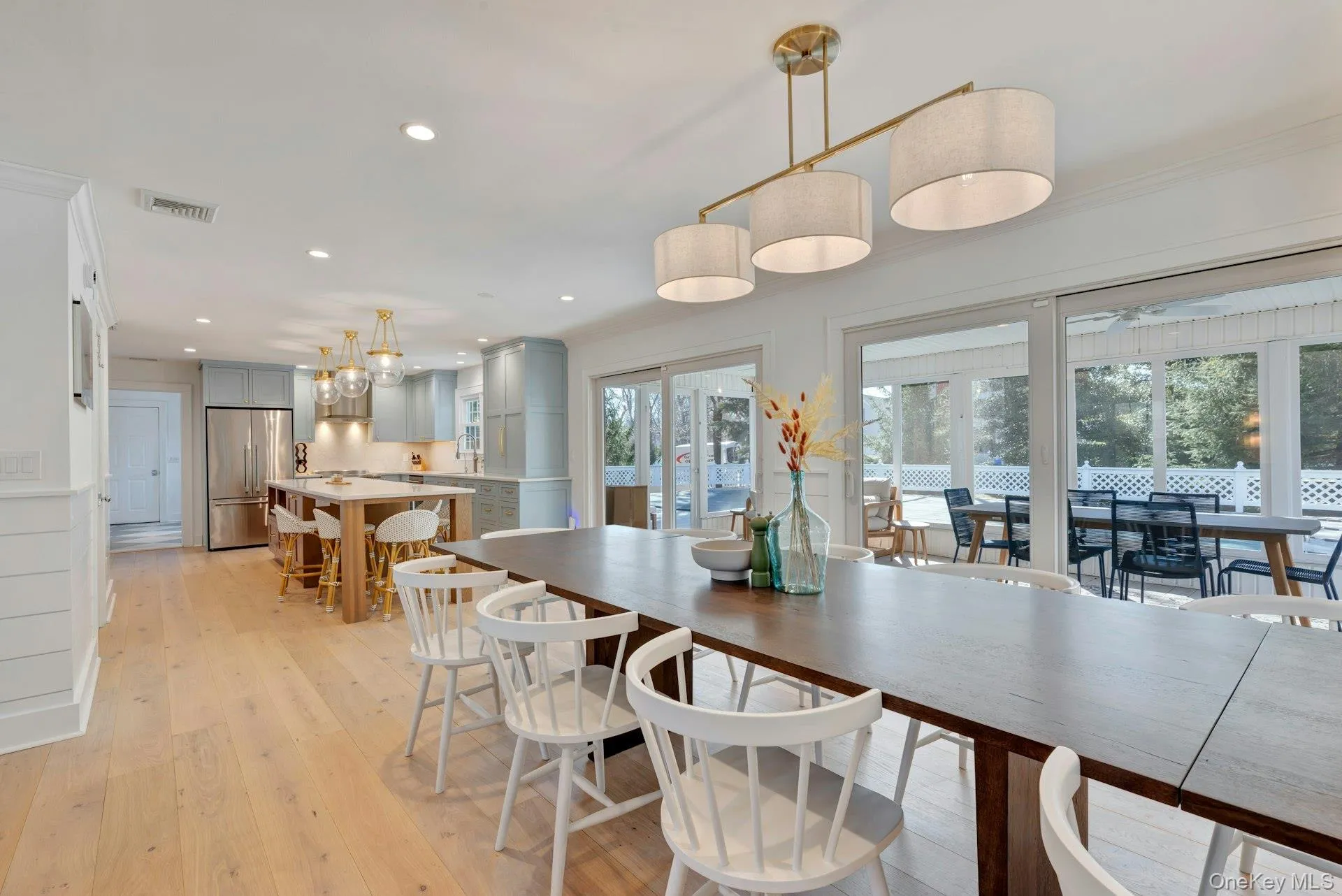 Dining space with light wood finished floors and recessed lighting Dining space with light wood finished floors and recessed lighting