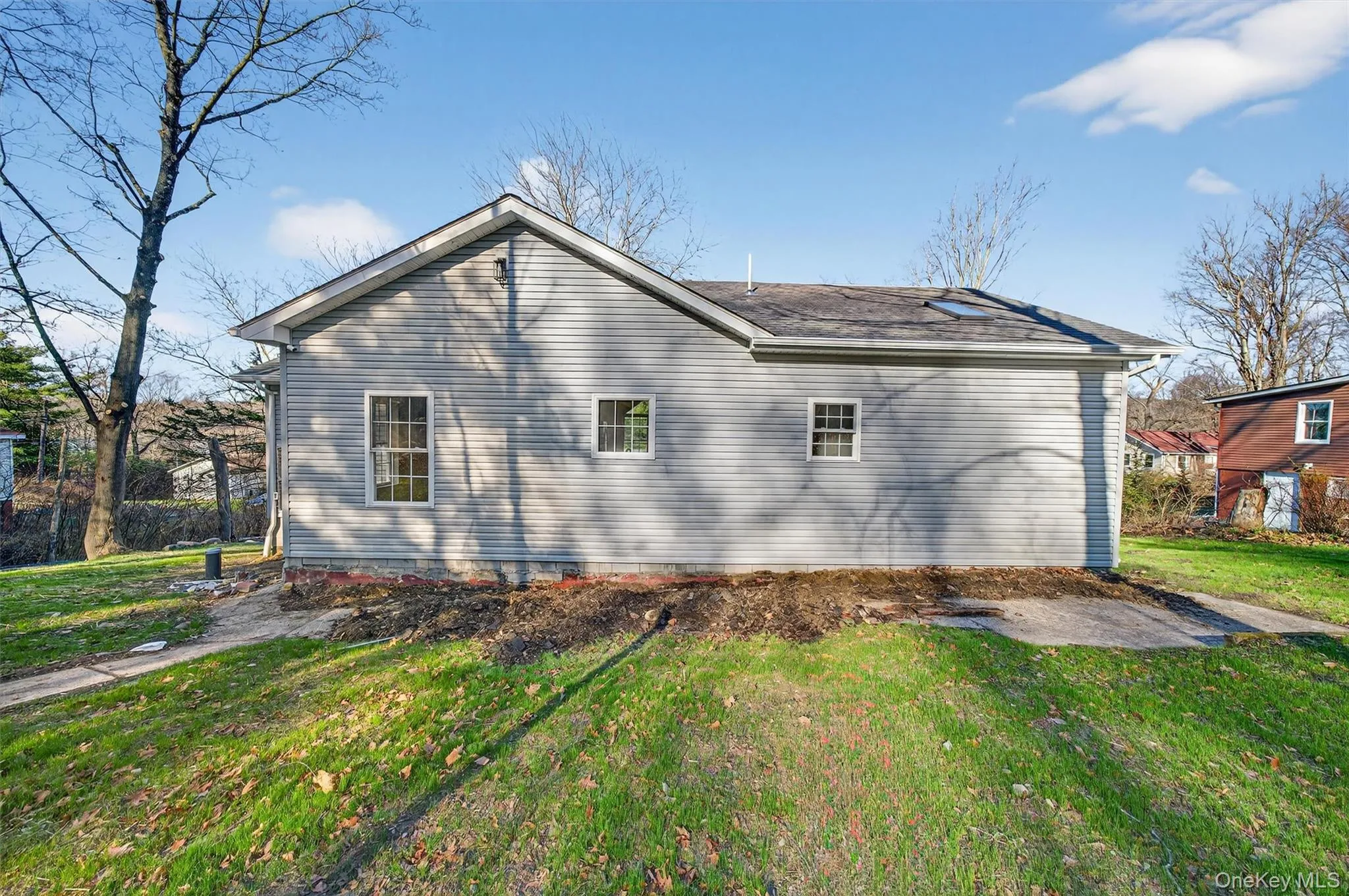 View of property exterior with a lawn View of property exterior with a lawn