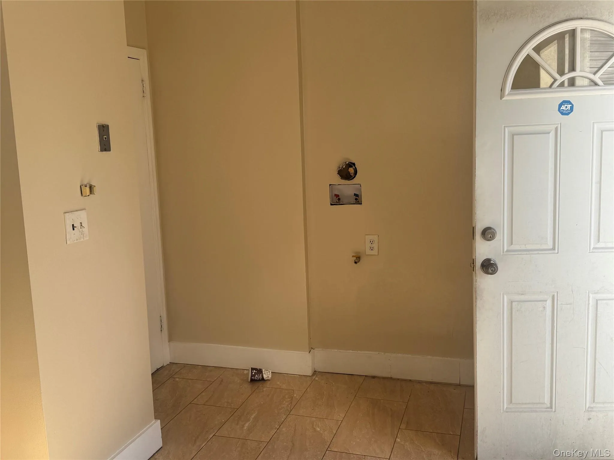 Washroom with baseboards and washer hookup Washroom with baseboards and washer hookup