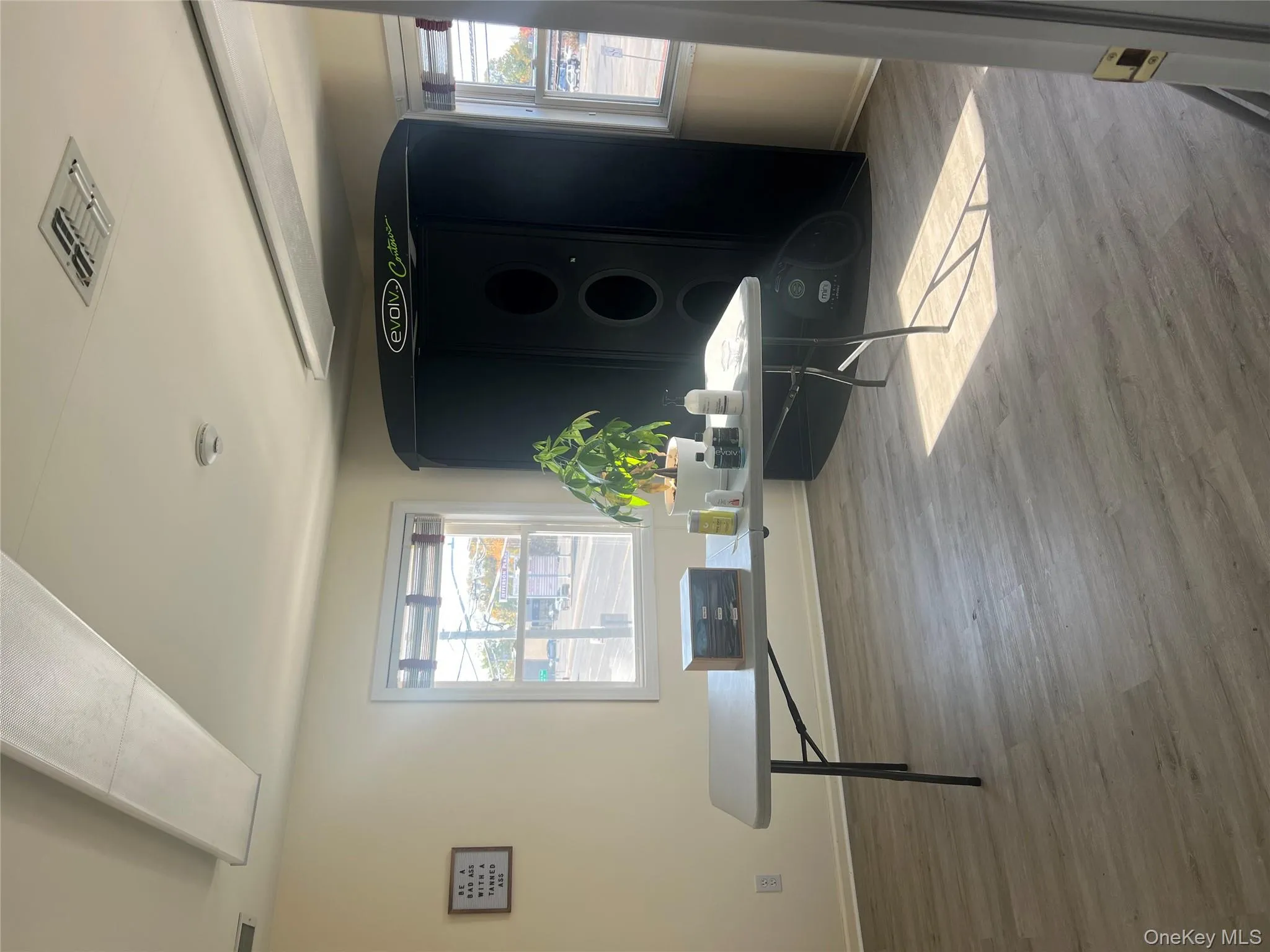 Office area featuring plenty of natural light and light wood-style floors Office area featuring plenty of natural light and light wood-style floors
