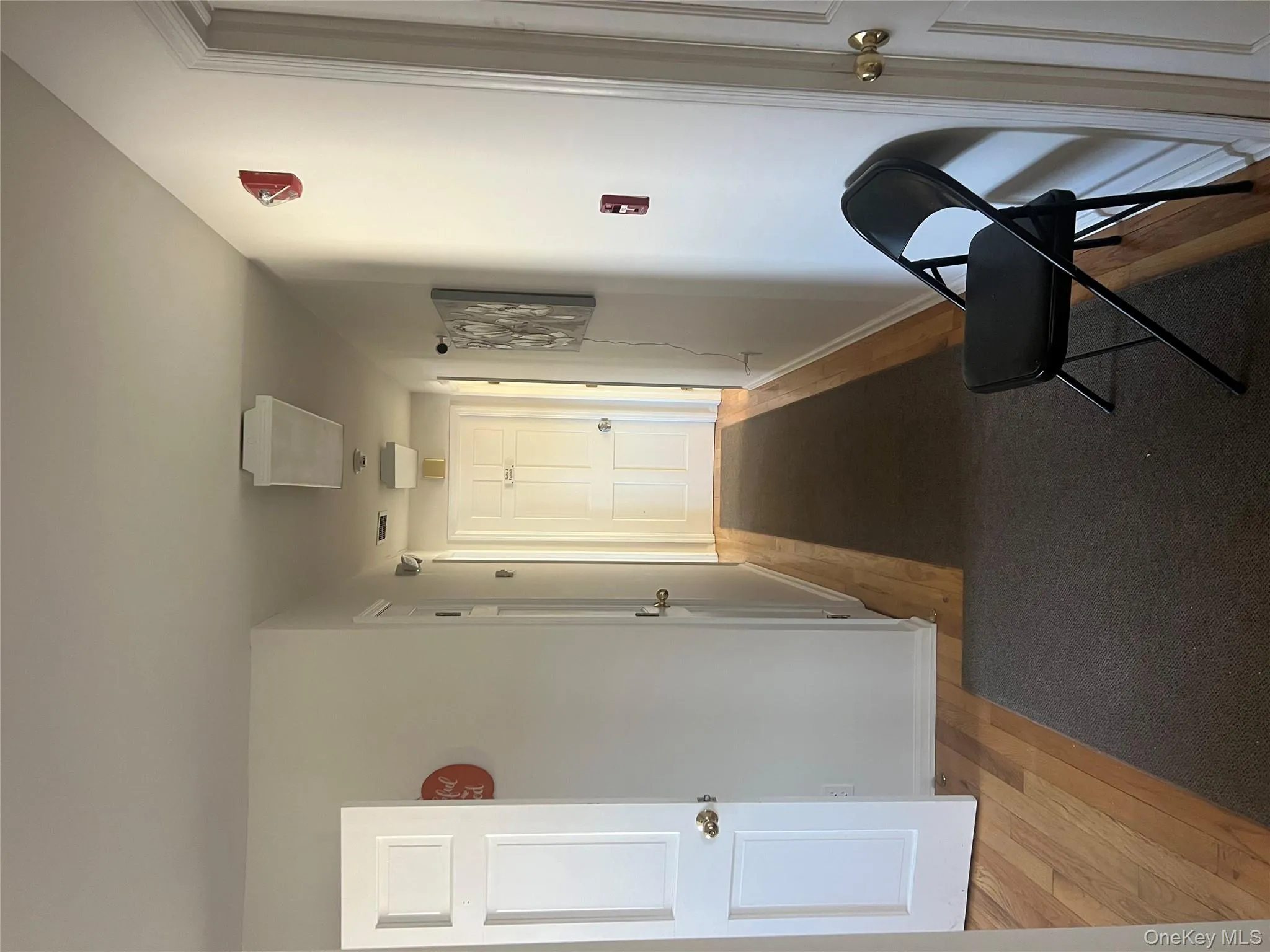 Hall featuring light wood-style floors and baseboards Hall featuring light wood-style floors and baseboards