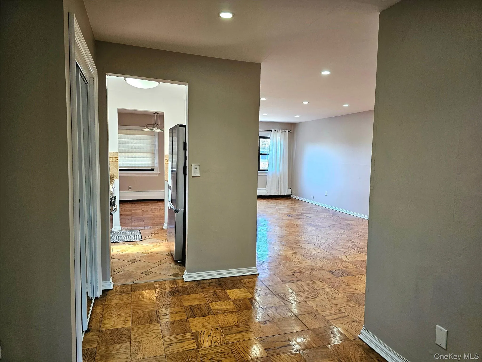 Corridor with baseboards and recessed lighting Corridor with baseboards and recessed lighting