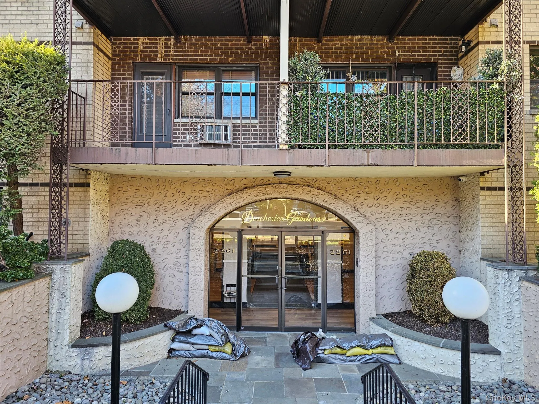 Doorway to property featuring french doors and brick siding Doorway to property featuring french doors and brick siding