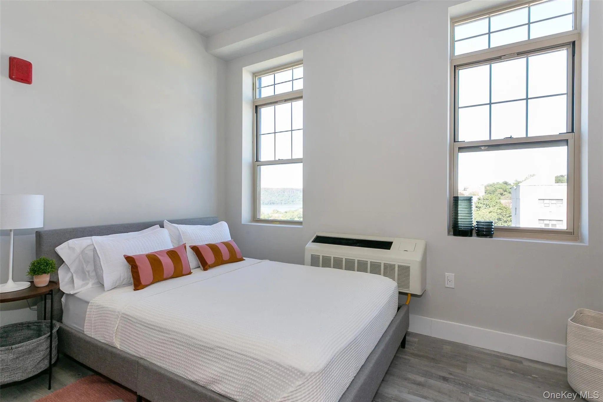 Bedroom with baseboards and wood finished floors Bedroom with baseboards and wood finished floors