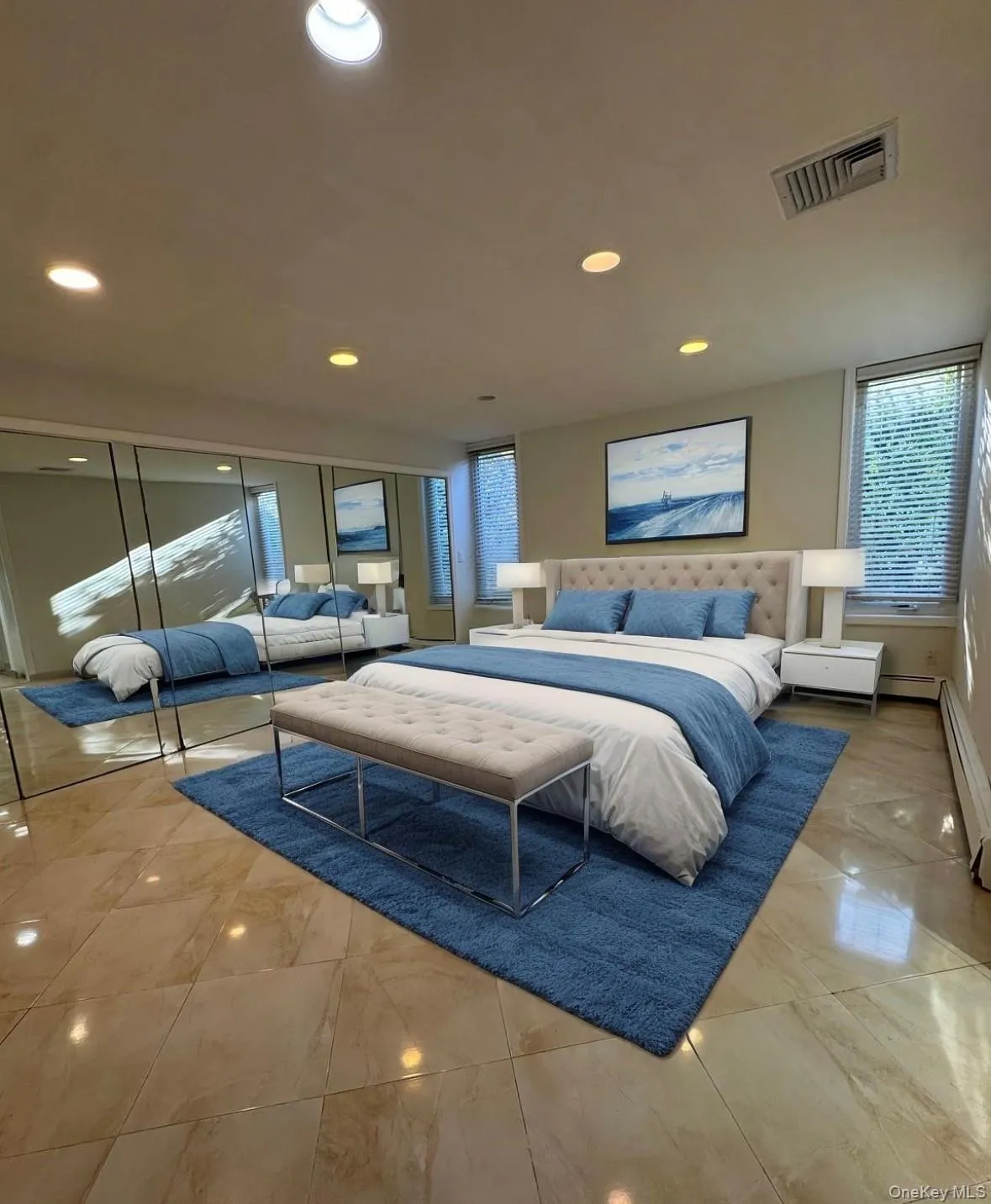 Bedroom featuring recessed lighting, a baseboard heating unit, and a closet Bedroom featuring recessed lighting, a baseboard heating unit, and a closet