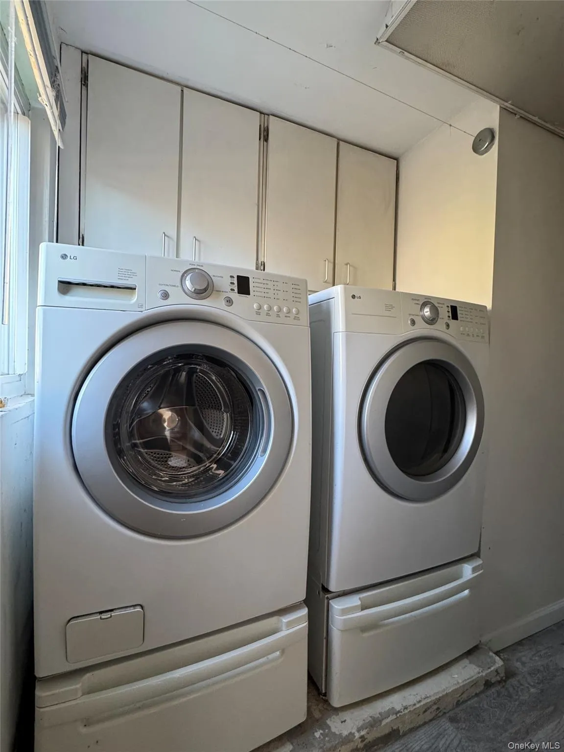 Laundry room featuring washer and clothes dryer Laundry room featuring washer and clothes dryer