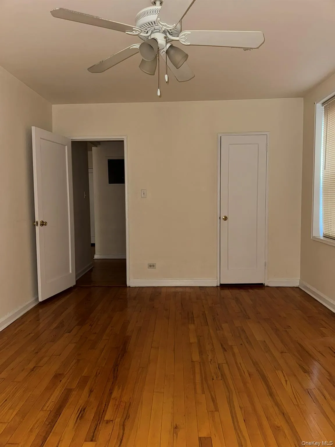 Spare room with hardwood / wood-style floors and ceiling fan Spare room with hardwood / wood-style floors and ceiling fan