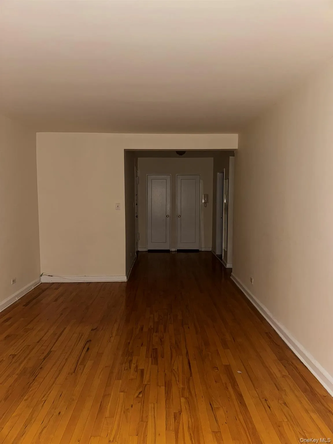 Empty room featuring wood-type flooring Empty room featuring wood-type flooring