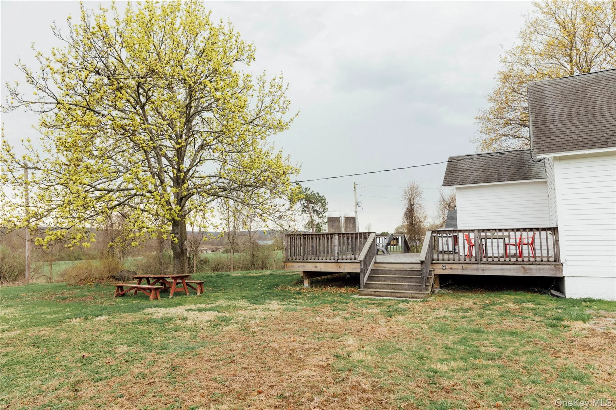 View of yard featuring a wooden deck View of yard featuring a wooden deck