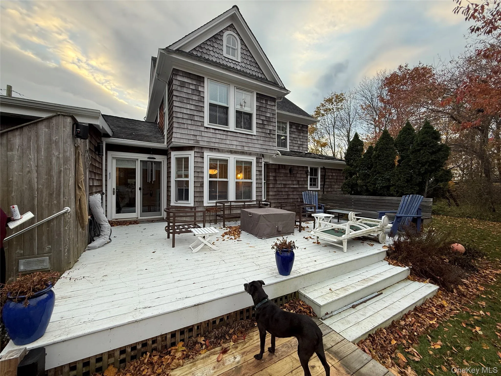 Deck at dusk with a hot tub Deck at dusk with a hot tub