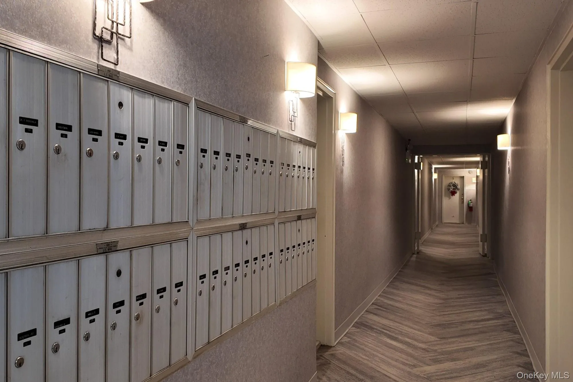 Hall with mail area and a textured wall Hall with mail area and a textured wall