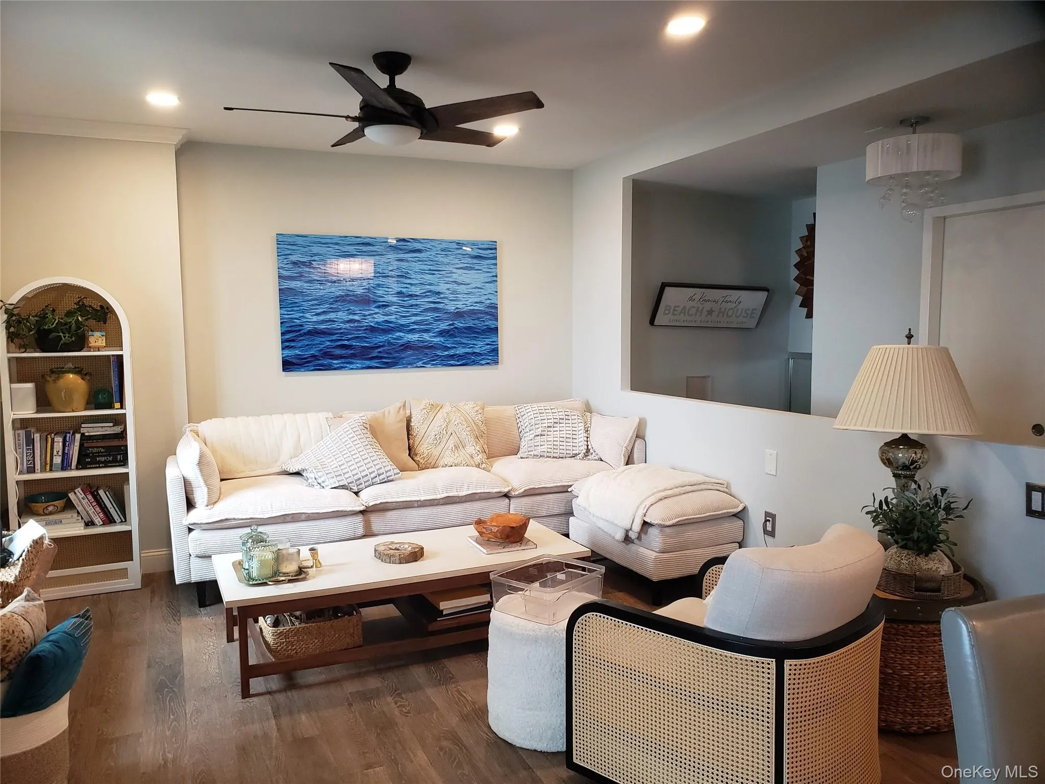 Living area featuring recessed lighting, ceiling fan, and wood finished floors Living area featuring recessed lighting, ceiling fan, and wood finished floors