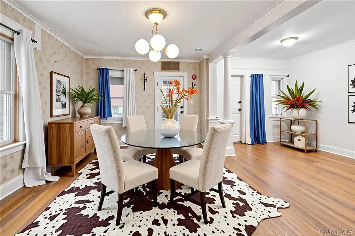 Virtual staging showcasing Option 2 for the space. Dining area and entry foyer. Virtual staging showcasing Option 2 for the space. Dining area and entry foyer.