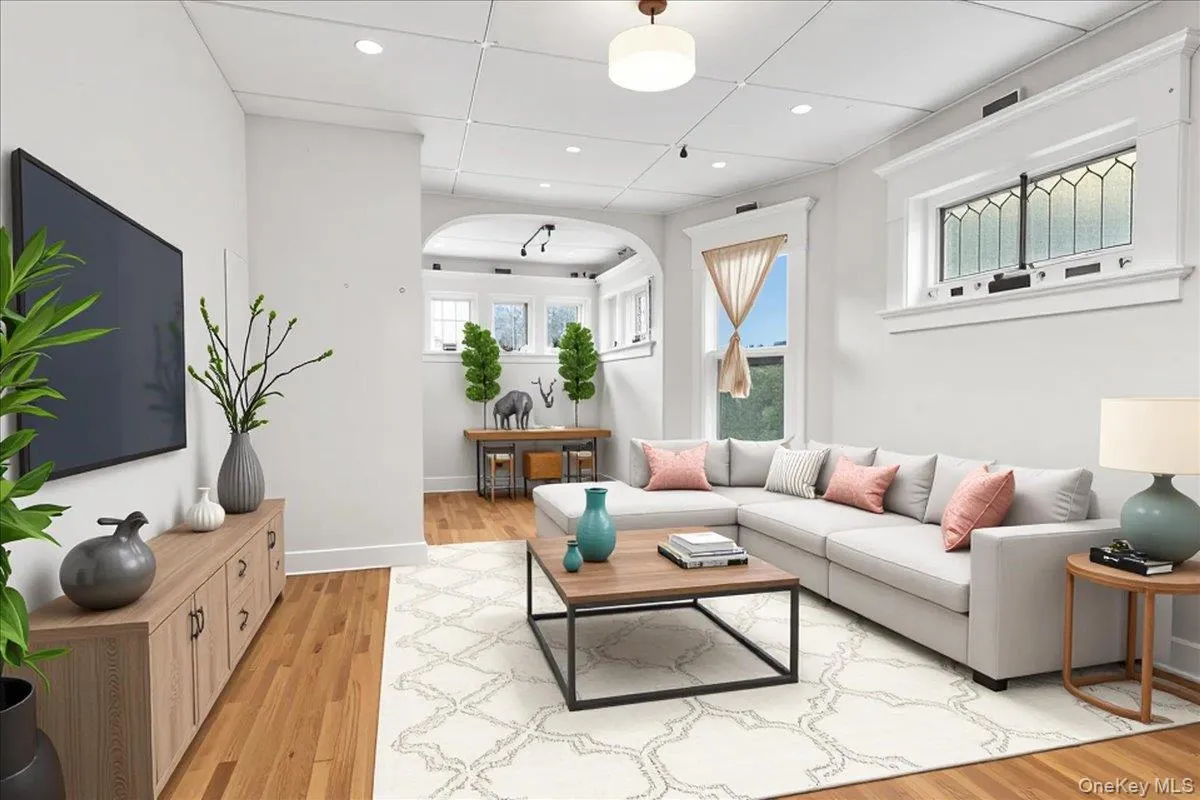Living area featuring light wood-type flooring and recessed lighting Living area featuring light wood-type flooring and recessed lighting