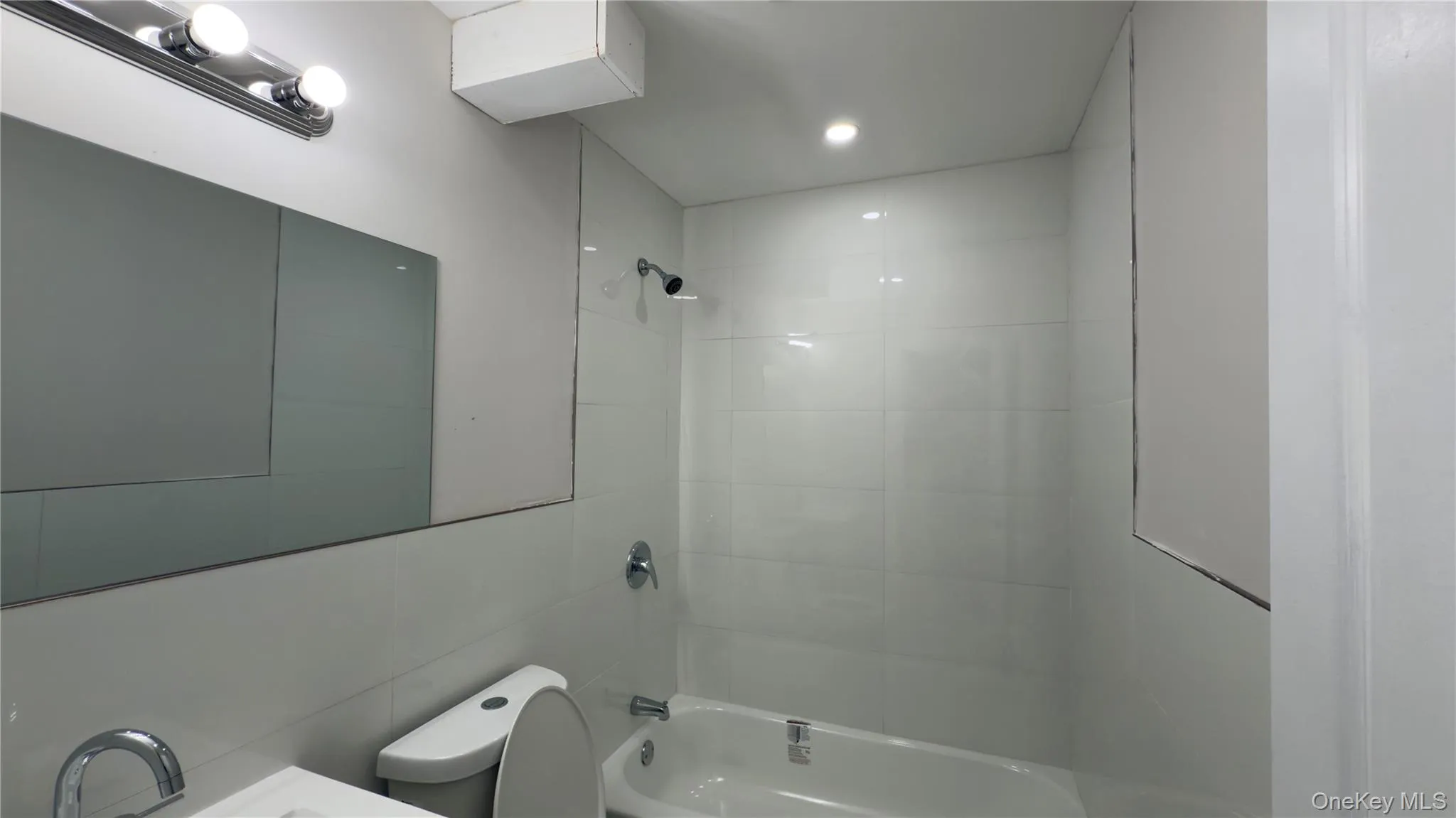 Bathroom with washtub / shower combination and vanity Bathroom with washtub / shower combination and vanity