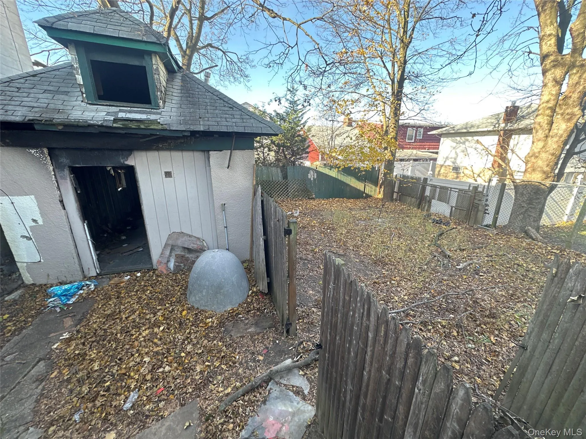 View of side of property with a fenced backyard View of side of property with a fenced backyard