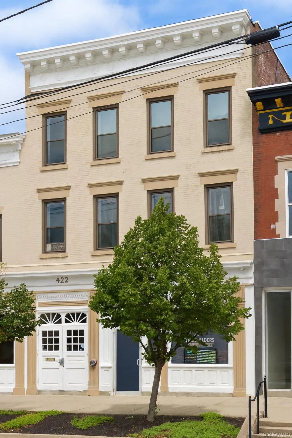 Italianate-style house with brick siding Italianate-style house with brick siding