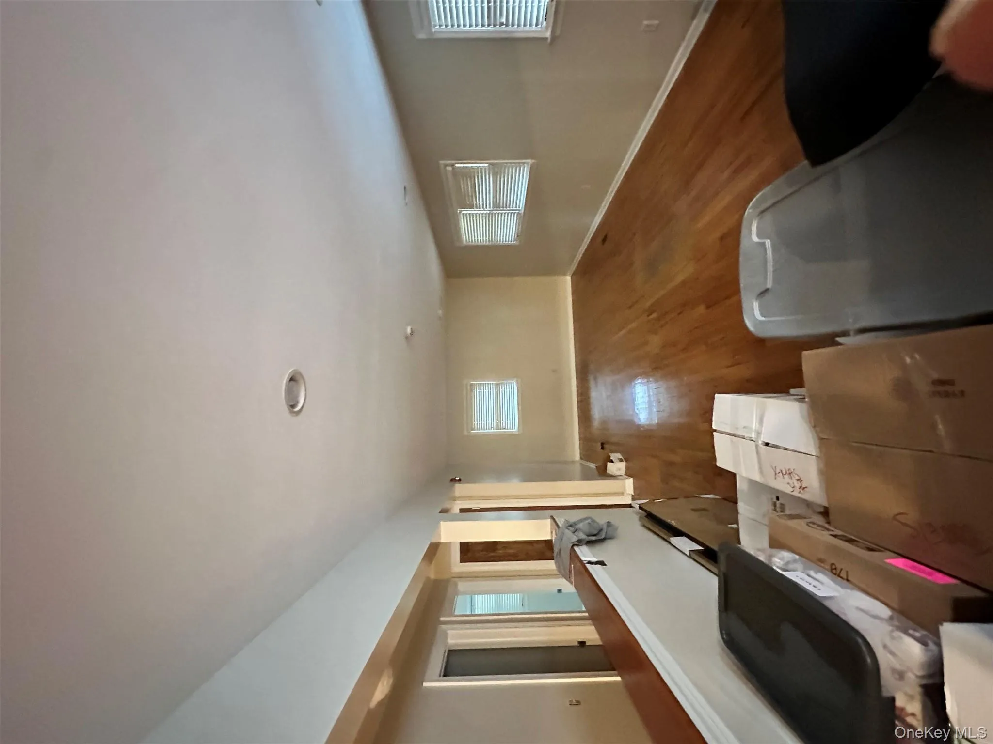 Living room featuring wood finished floors and baseboards Living room featuring wood finished floors and baseboards