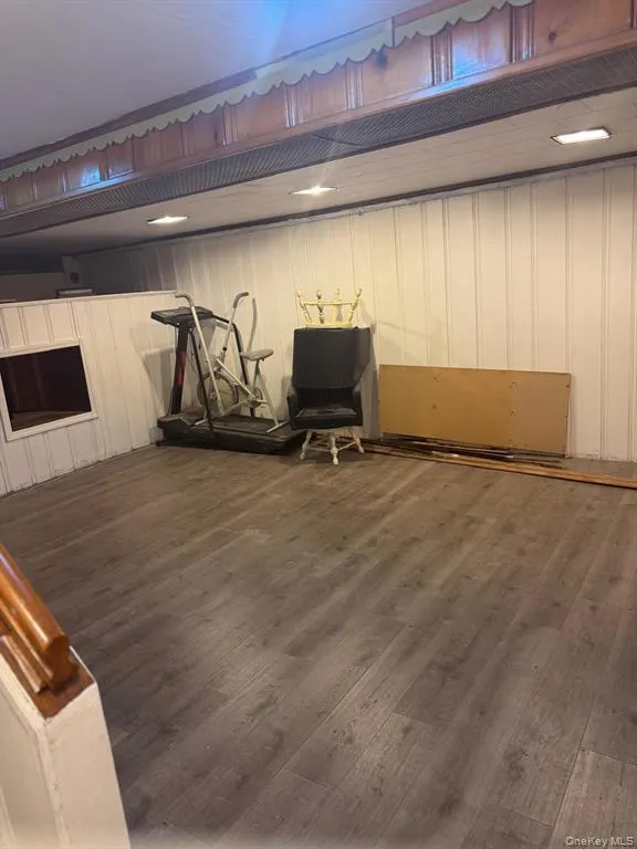 Exercise room featuring dark wood finished floors Exercise room featuring dark wood finished floors