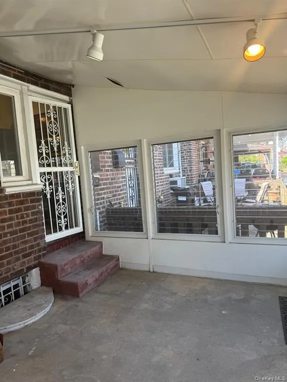 Property entrance with brick siding Property entrance with brick siding