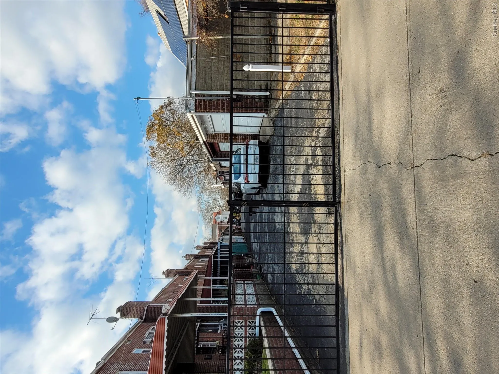 Gate featuring a fenced front yard and a residential view Gate featuring a fenced front yard and a residential view