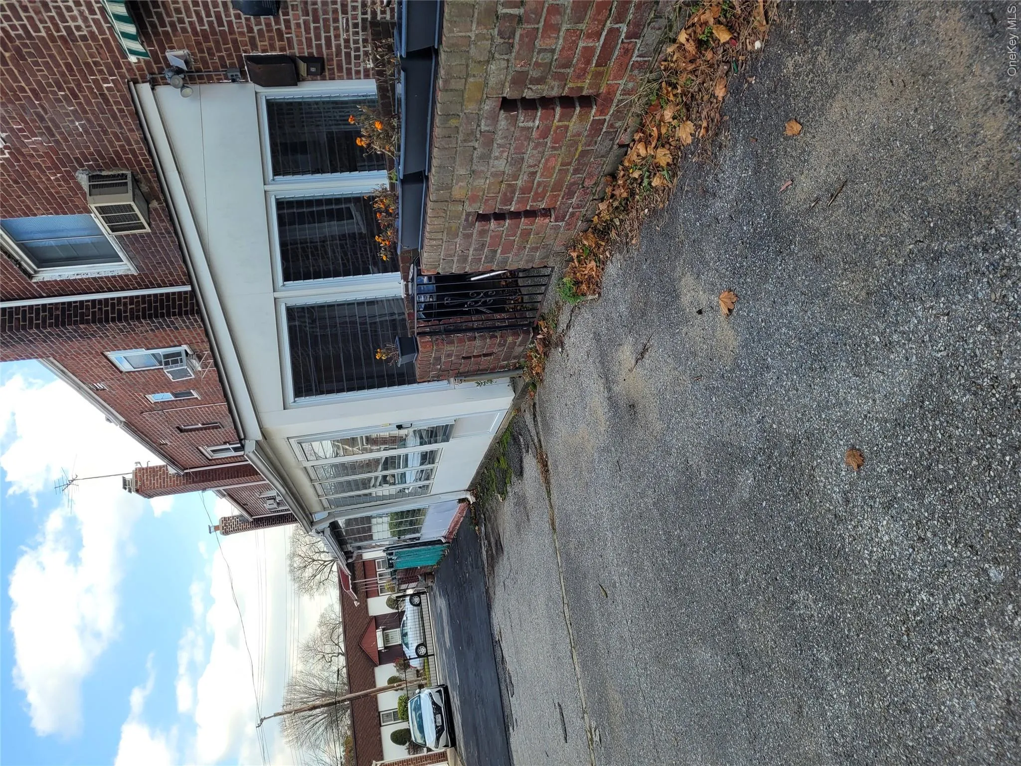 View of property exterior featuring a chimney and brick siding View of property exterior featuring a chimney and brick siding
