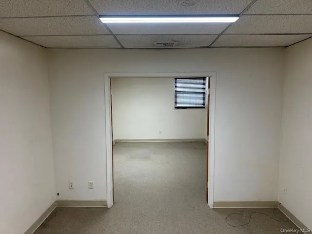 Spare room with a paneled ceiling Spare room with a paneled ceiling