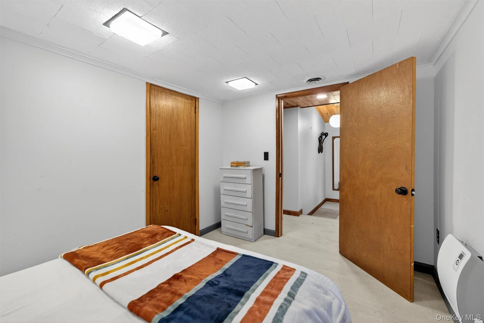 Bedroom featuring a closet and baseboards Bedroom featuring a closet and baseboards