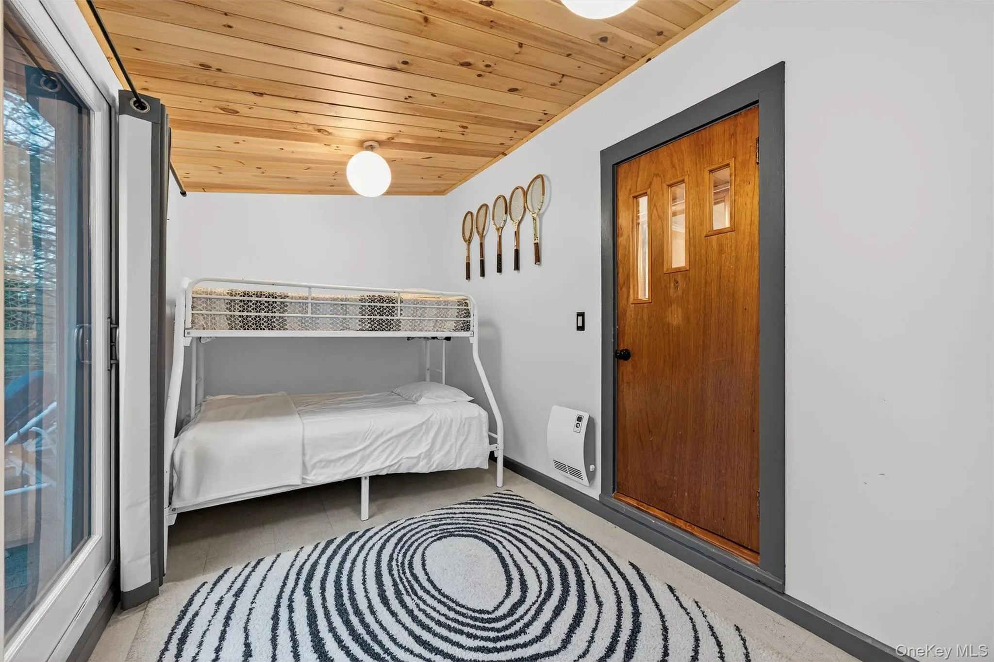 Bedroom with wooden ceiling, access to exterior, and heating unit Bedroom with wooden ceiling, access to exterior, and heating unit