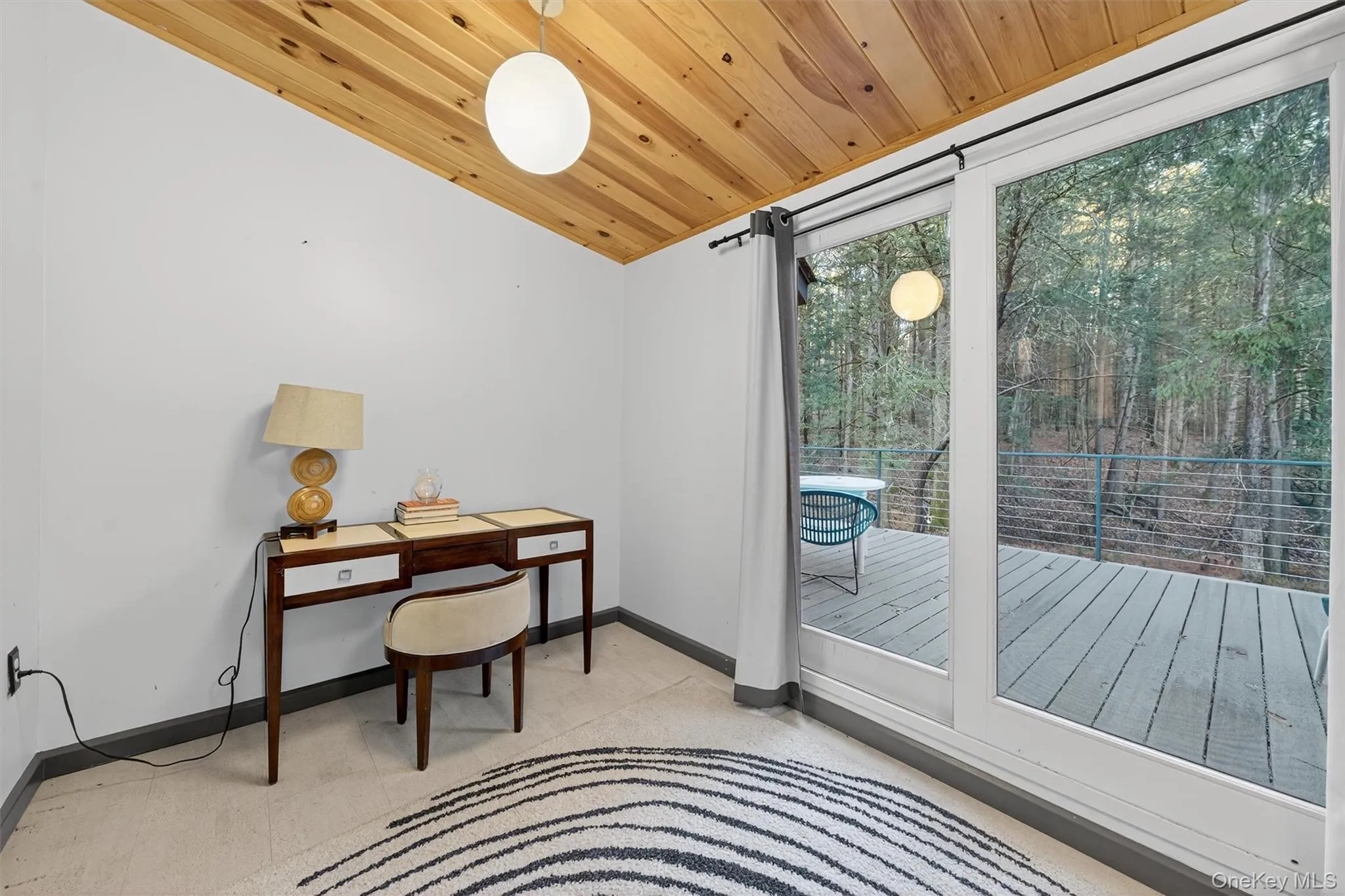 Home office with wood ceiling and lofted ceiling Home office with wood ceiling and lofted ceiling