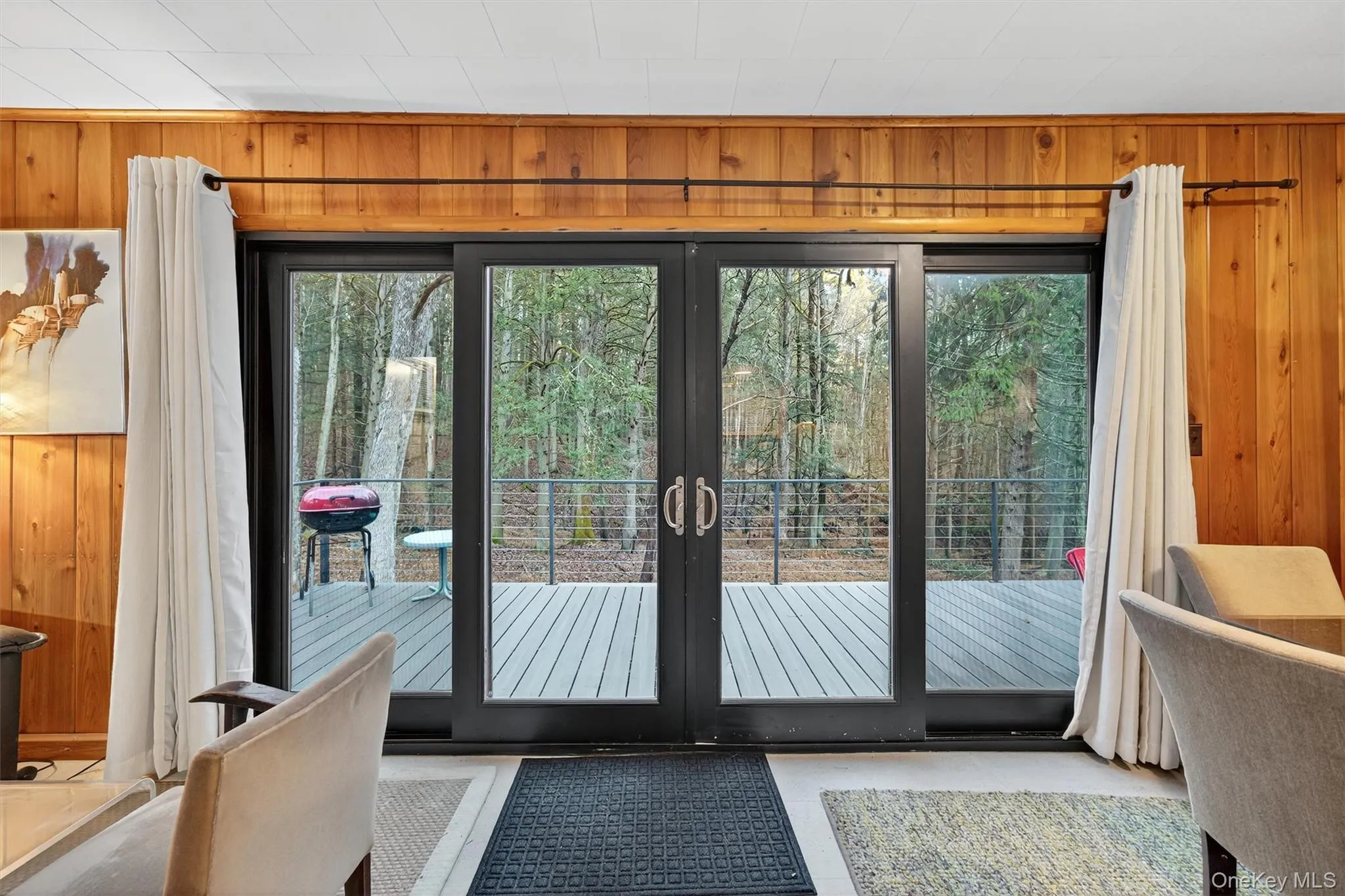 Entryway with wooden walls and plenty of natural light Entryway with wooden walls and plenty of natural light