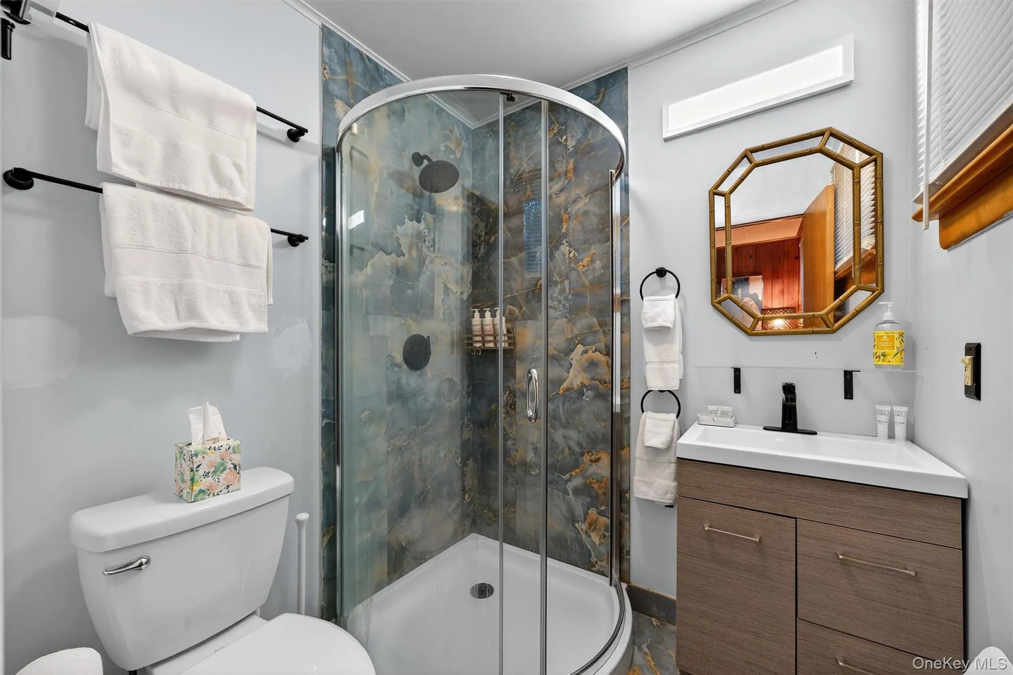 Full bath with vanity and a stall shower Full bath with vanity and a stall shower