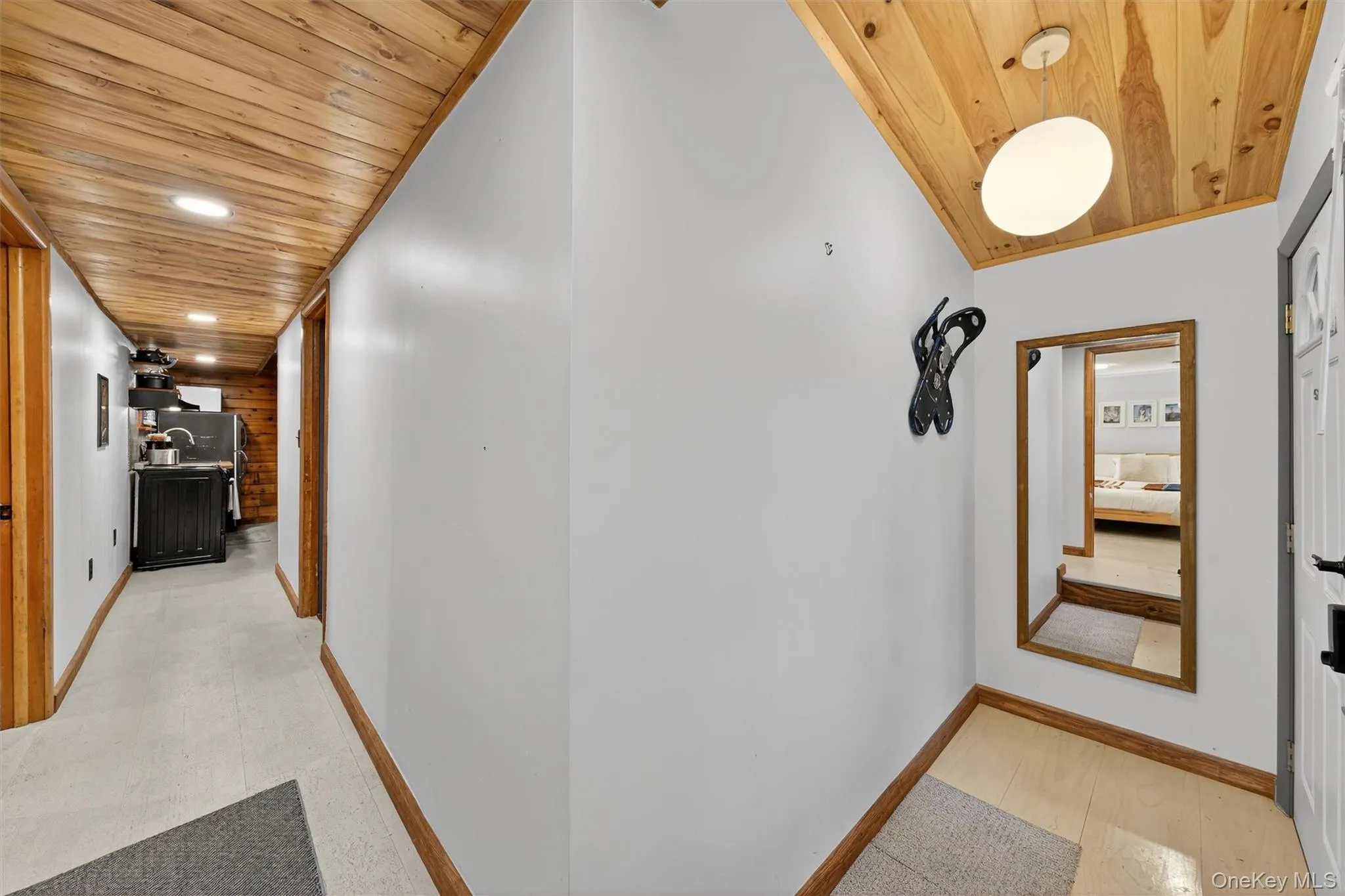 Hall featuring wood ceiling and recessed lighting Hall featuring wood ceiling and recessed lighting