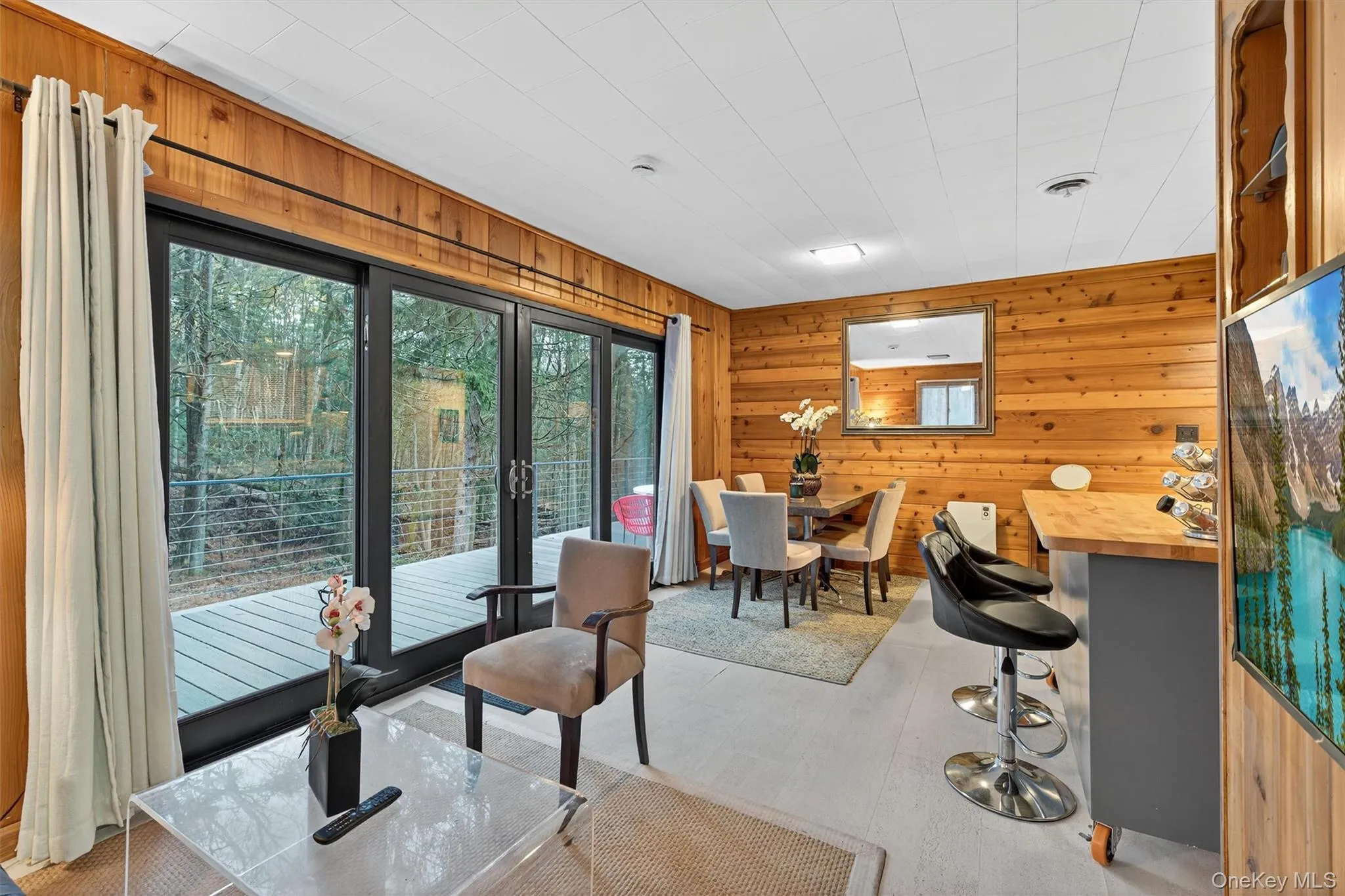Office area with wooden walls and healthy amount of natural light Office area with wooden walls and healthy amount of natural light
